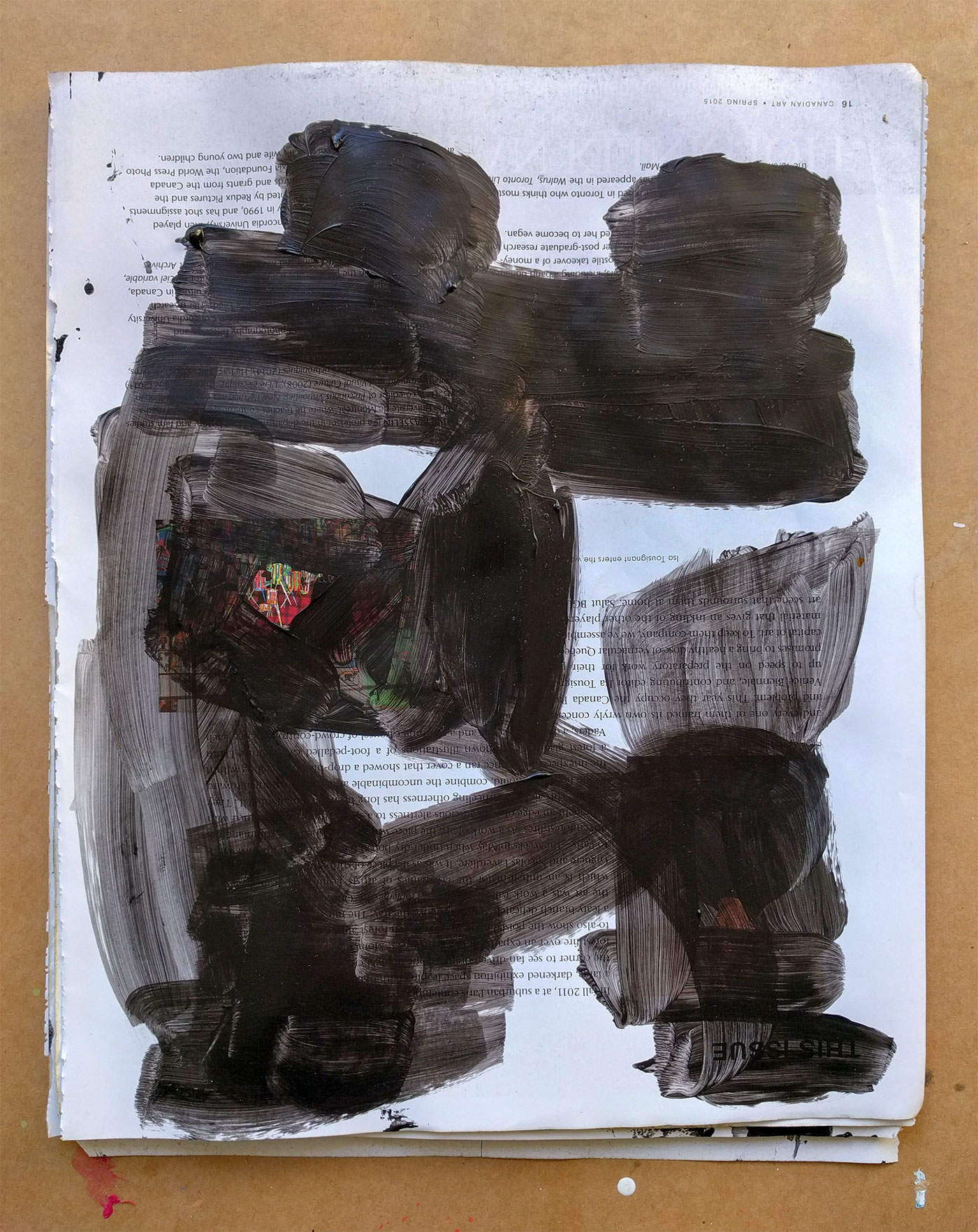 Blackout drawing - black acrylic on glossy art magazine page obscuring any images of art or people. 